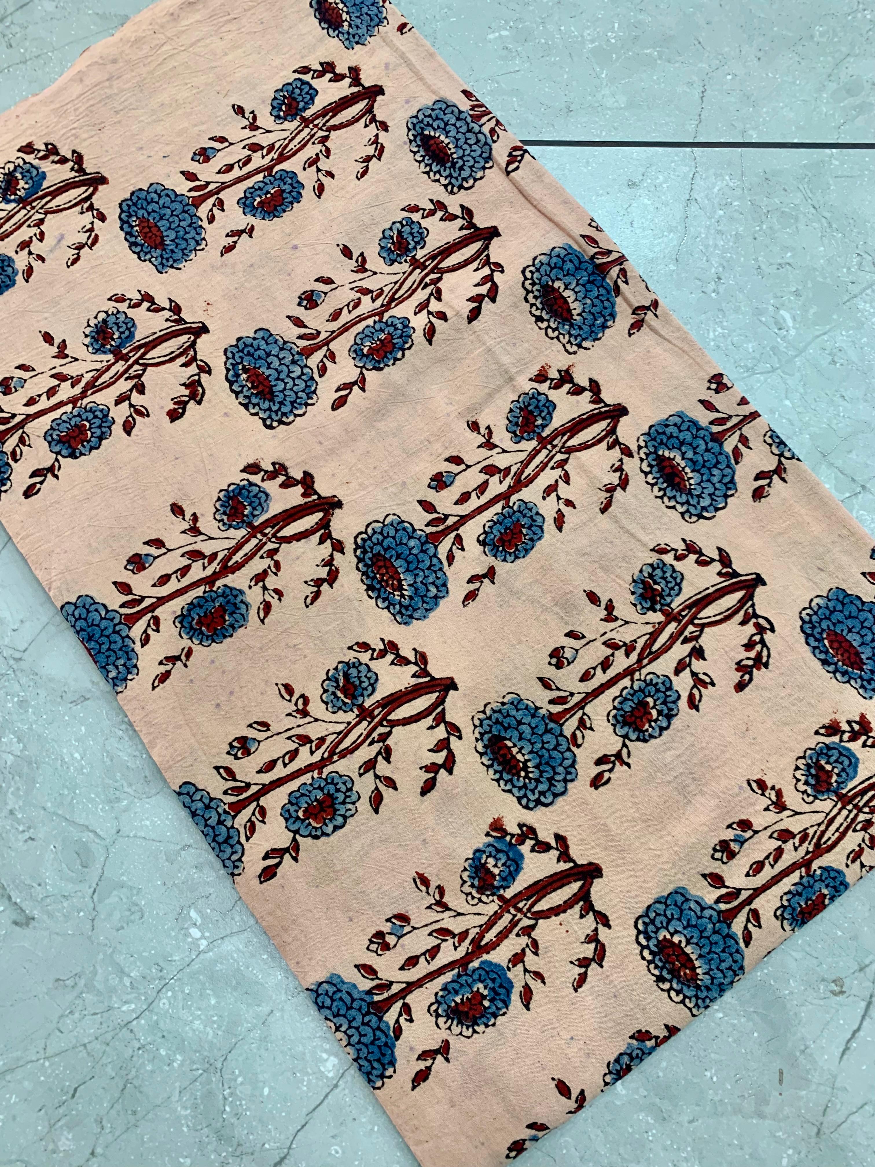 Cream Ajrakh pure cotton handblock printed wholesale fabric featuring delicate floral motifs by Fabtexs.